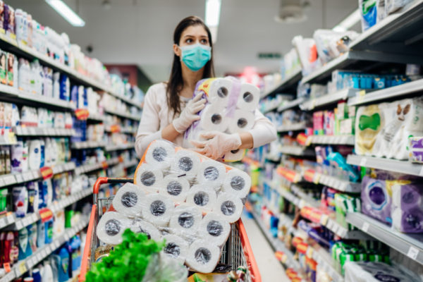 Toilette paper shortage.Woman with hygienic mask shopping for to